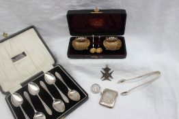 A pair of late Victorian silver shell salts, Birmingham, 1895 together with matching spoons, cased,