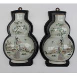 A pair of 19th century Chinese porcelain wall pockets, in the form of double gourd vases,