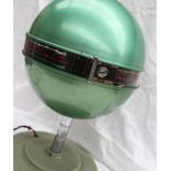 A 1940s / 1950s Emor Globe table top radio in green,