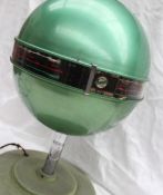 A 1940s / 1950s Emor Globe table top radio in green,