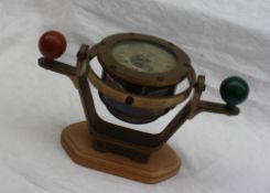 A 20th Century desk model of a brass compass binnacle the card with makers Bergen Nautik, Bergen,