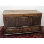 An 18th century oak coffer,