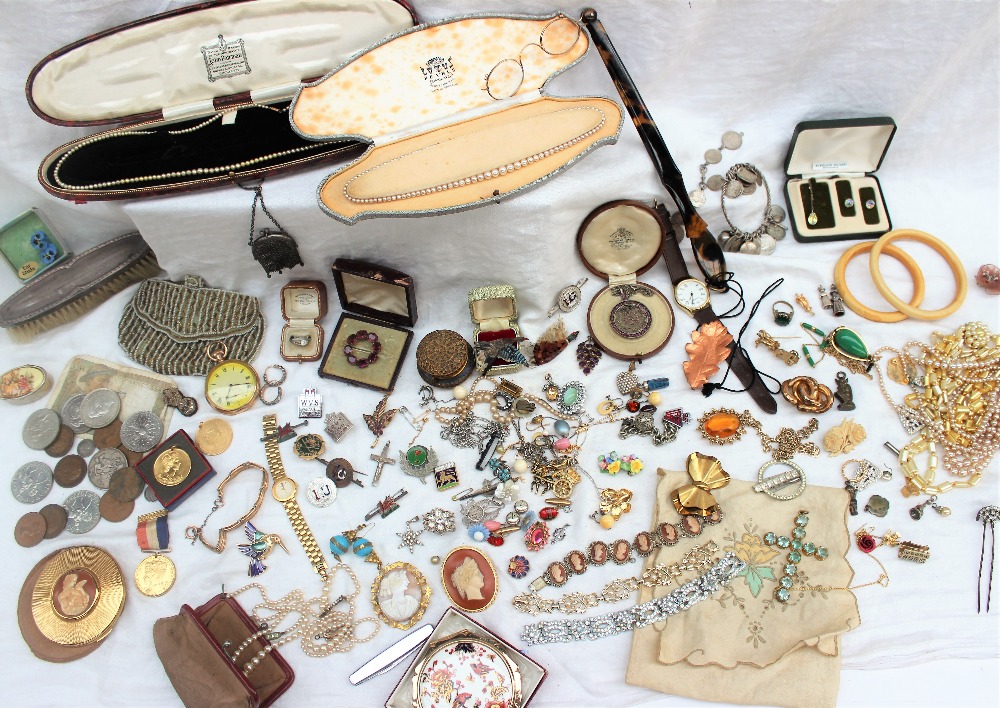 A quantity of costume jewellery including a pocket watch, cameo brooch, rings, faux pearls,