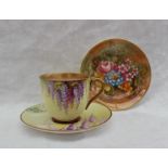 A Royal Worcester porcelain cabinet cup and saucer, painted with wisteria to a yellow ground,