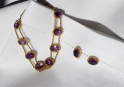 An amethyst and 9ct yellow gold bracelet set with nine oval faceted amethysts each approximately