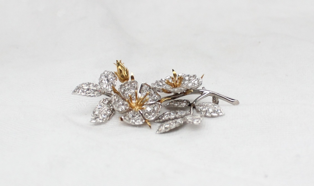 An 18ct yellow and white gold brooch in the form of flower heads, - Image 2 of 3