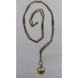 A yellow metal long chain approximately 30.