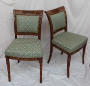 A pair of Dutch walnut and marquetry decorated dining chairs,