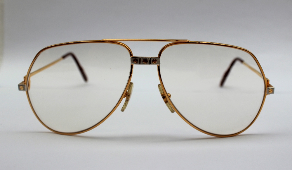 A pair of Must de Cartier Glasses with gilt rims, - Image 2 of 4