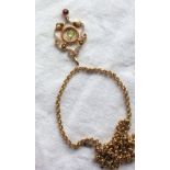 An Edwardian peridot and 9ct yellow gold brooch together with a 9ct yellow gold chain approximately