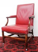 A George III mahogany library chair, with a pad upholstered back,