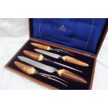 A late Victorian / Edwardian Mappin and Webb steel and ivory five piece carving set,