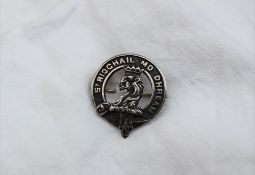 A George V silver Clan Gregor badge, with a lions head erased,