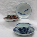 A Nanking Cargo blue and white tea bowl and saucer, decorated with a cottage on a hill,