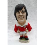 A resin Grogg of Barry John, in a red Wales jersey with a No.