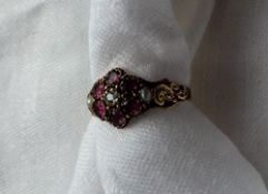 A Victorian amethyst, diamond and pearl set cluster ring set with a central old cut diamond,
