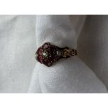 A Victorian amethyst, diamond and pearl set cluster ring set with a central old cut diamond,