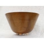 A teak and white metal bowl of flared tapering form on a white metal base marked Newport Sterling