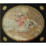 A George III silkwork picture of oval form depicting a figure in a turban and a reclining maiden