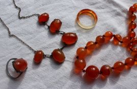 A carnelian bead necklace together with a carnelian necklace,