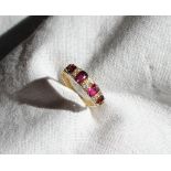 A ruby and diamond line ring,