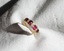 A ruby and diamond line ring,
