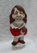 A Grogg Shop pottery Grogg of JPR Williams in a red Wales jersey,