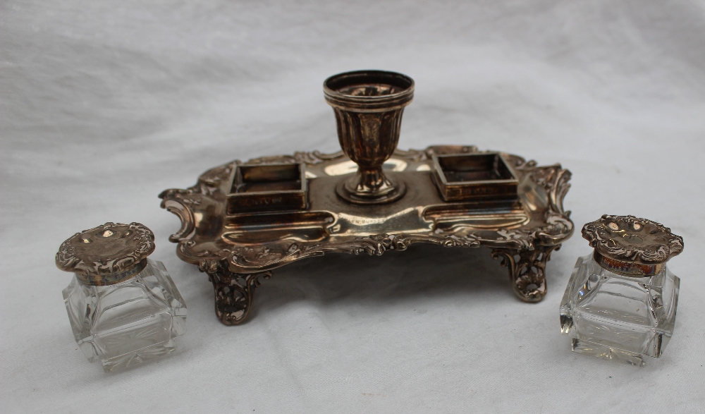 A late Victorian silver desk standish, with a central urn and two glass and silver topped inkwells, - Image 2 of 5