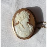 A 9ct yellow gold shell cameo, depicting a maiden with hair tied back and pearl necklace,