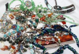 A large and extensive array of costume jewellery including bead necklaces, brooches, pendants,