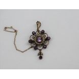 An amethyst and seed pearl pendant on a yellow metal setting CONDITION REPORT: Not