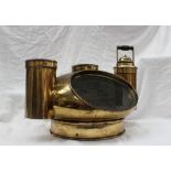 A brass binnacle hood the ovoid cover with oval observation window and circular lamp holders to