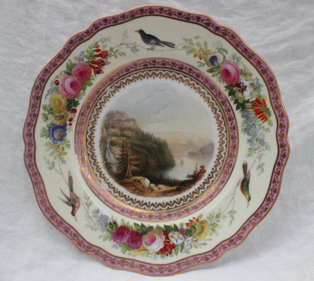 A continental porcelain plate with a scalloped edge painted to the centre with an image of Lake