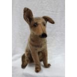 A 1930s stuffed toy of a seated German Shepherd,