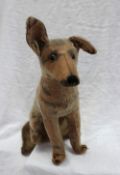 A 1930s stuffed toy of a seated German Shepherd,