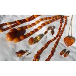 An amber bead necklace together with a faceted amber bead necklace, an oval link amber necklace,