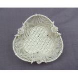 A Belleek porcelain basket weave trefoil dish, applied with roses and buds, strap work mark,