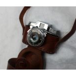 A Mycro sub-miniature camera in leather case