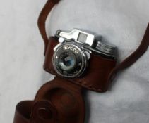 A Mycro sub-miniature camera in leather case