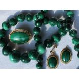 A malachite bead necklace together with a pair of malachite and 9ct gold earrings and matching