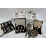 A set of three George VI silver napkin rings, Birmingham, 1946 together with silver spoons,