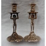 A pair of Elizabeth II Britannia standard silver candlesticks,