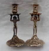 A pair of Elizabeth II Britannia standard silver candlesticks,