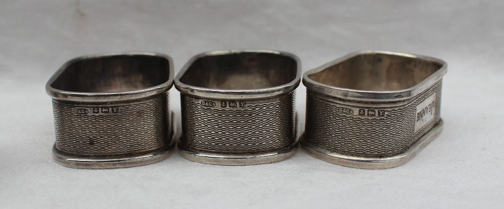 A set of three George VI silver napkin rings, Birmingham, 1946 together with silver spoons, - Image 8 of 8