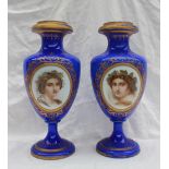 A pair of 19th century opaque and blue glass vases, with a gilt rim,