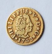 A Philippus V gold 1/2 Escudo, dated 1743 approximately 1.