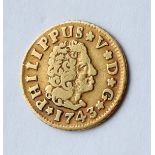 A Philippus V gold 1/2 Escudo, dated 1743 approximately 1.