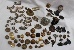 A collection of cap badges including South Wales Borderers, The Lancashire Fusilier's,