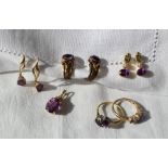 An amethyst and topaz ring set with three oval amethysts and two oval topaz to a 9ct yellow gold