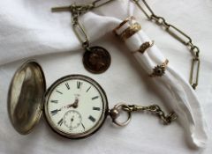 A silver hunter pocket watch, the enamel dial with Roman numerals and a seconds subsidiary dial,